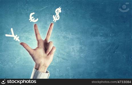 Currency concept. Hands and money currency signs on fingers
