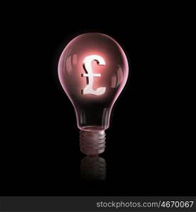 Currency concept. Light bulb with euro symbol on dark background