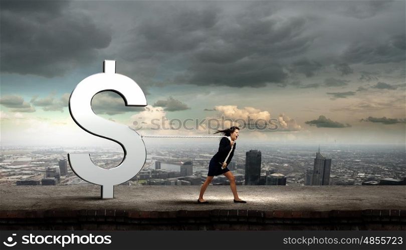 Currency concept. Young businesswoman pulling dollar sign with rope