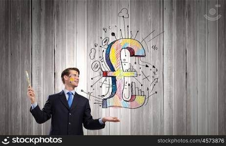 Currency concept. Young handsome businessman holding pound symbol in palm