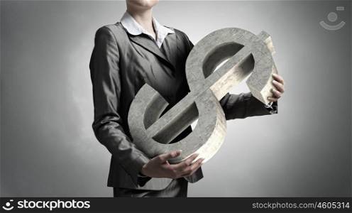 Currency rate symbol. Close up of businesswoman and dollar symbol in her palms