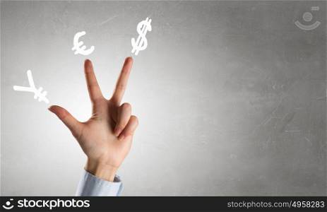 Currency symbols as concept. Hands and money currency signs on fingers as YES word