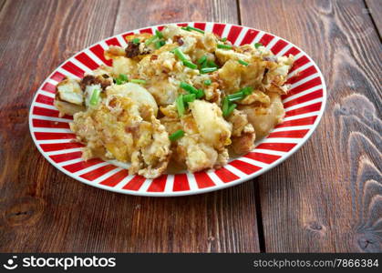 Curried Hash Brown Scramble - crispy browned potatoes tossed sauteed onions, curry powder, and scrambled eggs