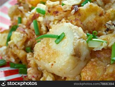 Curried Hash Brown Scramble - crispy browned potatoes tossed sauteed onions, curry powder, and scrambled eggs