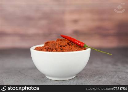 curry paste and red chilli peppers background / ingredients table asian food spicy in thailand