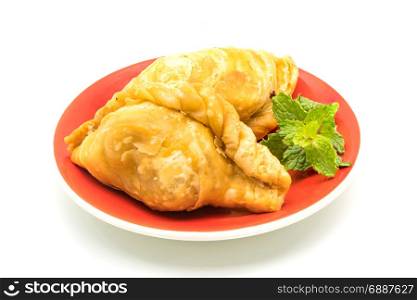 Curry Puffs in a red plate on white background
