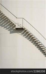 Curve line of spiral staircase on oil storage fuel tank in vertical frame