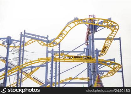 curved rollercoaster tracks clear sky