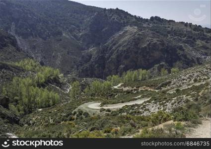 curved walking track in the mountains of andalusia in spain near Zuheros Village. mountains landscape in andalusia spain