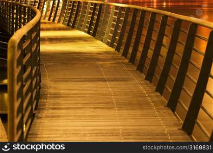 Curved Walkway With Railings in Yellow Light
