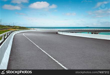Curvy flyover highway asphalt road with with beautiful landscape , morning scene .