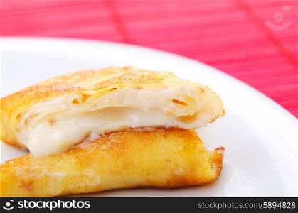 Custard filled pancake in plate