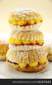 Custard pastry cakes stacked on top of one another.