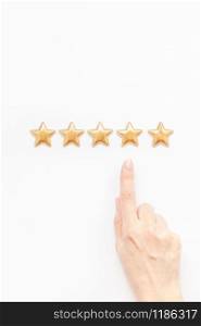 Customer Experience Feedback Concept. Golden five 5 stars, best excellent services rating with woman hand for satisfaction isolated on white background. Top view, copy space for your text