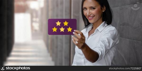 Customer Experiences Concept. Happy Young Business Woman Giving Five Stars Rating and Positive Review on Card. Client&rsquo;s Satisfaction Surveys. Front View