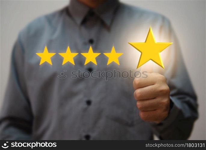 Customer hand holding smart phone and five star with copy space. Best Excellent Services Rating for Satisfaction.Customer experience satisfaction concept.