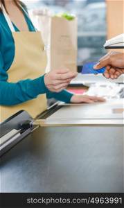 Customer handing a sales assistant a credit card
