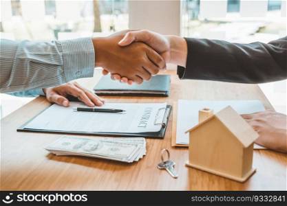 Customer handshake and sign agreement buying home ,salesman receive money after good deal after successful loan contract