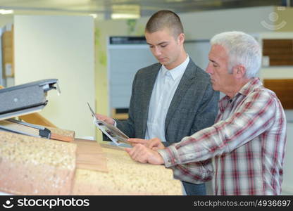 Customer looking at roof tiles