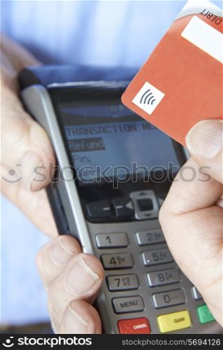 Customer Making Purchase Using Contactless Payment