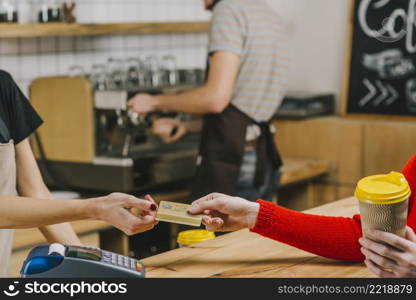 customer paying beverage cafe