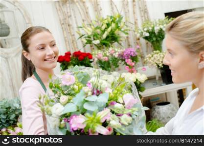 Customer picking up a bouquet of flowers