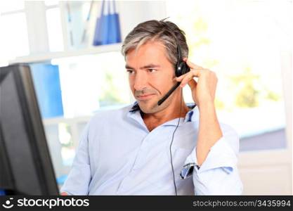 Customer service employee with headphones