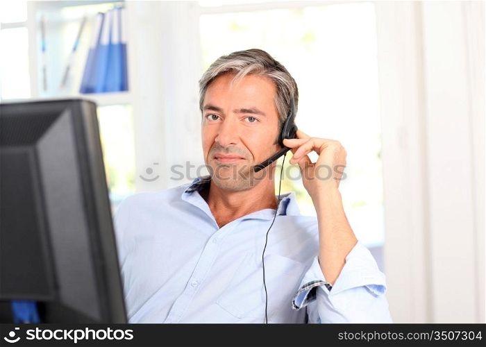 Customer service employee with headphones