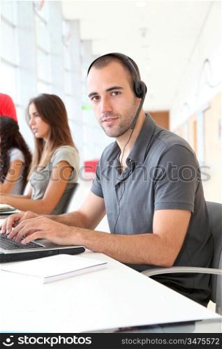 Customer service employee with headphones on
