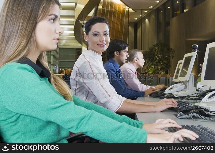 Customer service representatives working in an office