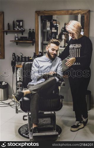 customer showing magazine barber