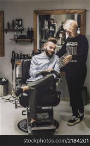 customer showing magazine barber