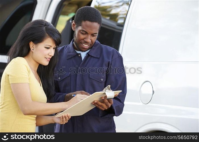 Customer Signing For Delivery From Courier