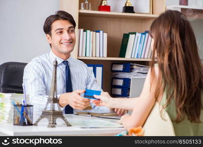 Customer visiting travel agency and talking to agent