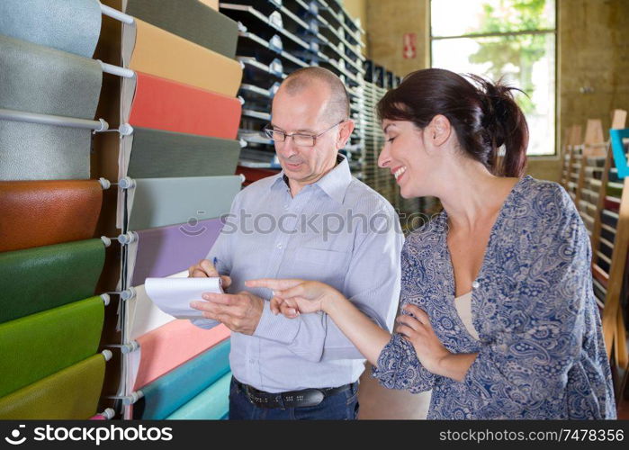 customer with trade supplier by display of colour samples