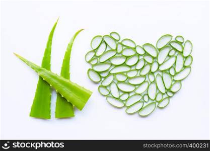 Cut Aloe Vera leaves with slices on white background.
