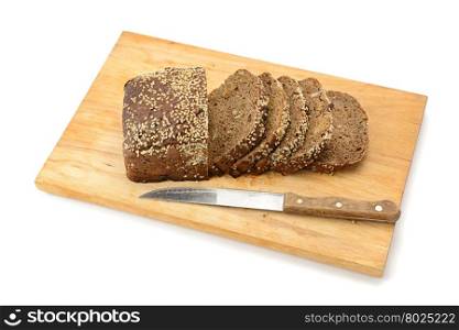 cut bread on breadboard isolated on white