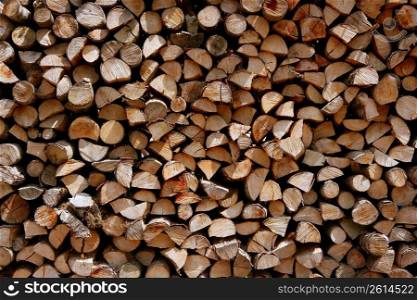 Cut firewood stack logs as pattern background