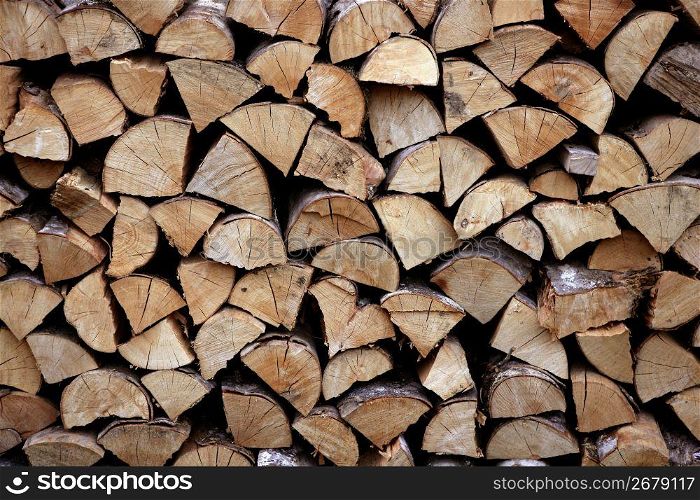 Cut firewood stack logs as pattern background