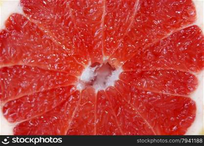 cut grapefruit. cut fruit of red grapefruit on the board