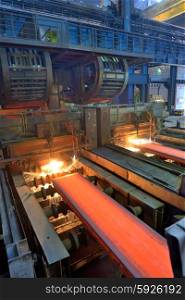 cut hot steel on conveyor inside of steel plant