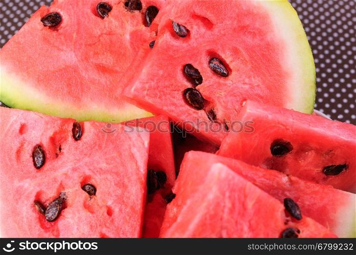 Cut into pieces of ripe red watermelon