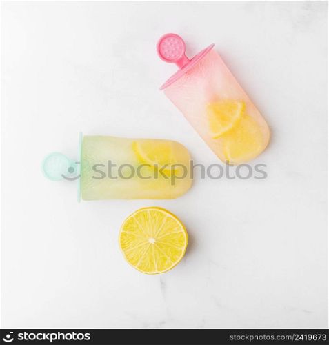 cut lemon fresh ice popsicle with citrus colorful sticks