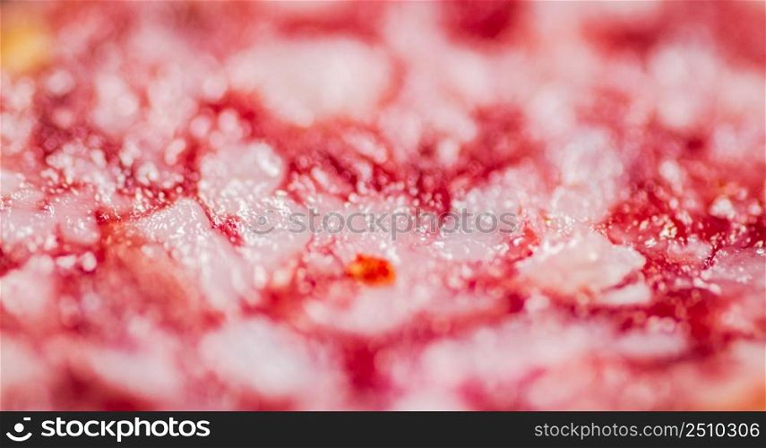 Cut of salami sausage. Macro background. Salami texture. High quality photo. Cut of salami sausage. Macro background.