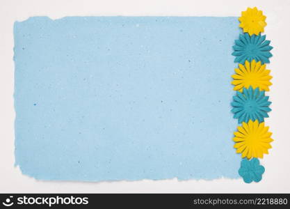 cut out flowers border blue paper white backdrop