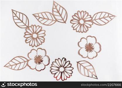 cut out golden flowers leaves white background