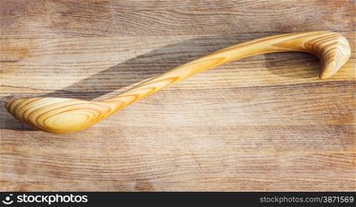 cut out wooden spoon on cutting board
