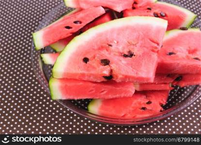 Cut pieces of red watermelon on a plate