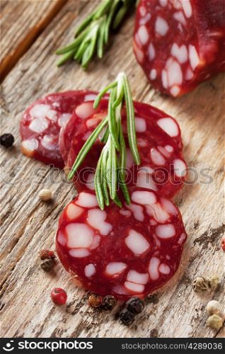 Cut pieces of smoked sausage with rosemary