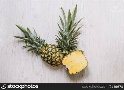 cut pineapple white table